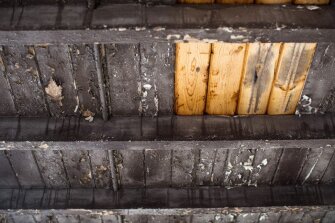 The underside of a newly-patched roof covers a breezeway that students use between classes at Collins Middle School in Fayette County.