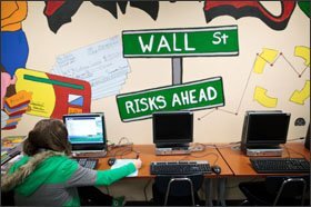 Students in the school’s Junior Academy of Finance learn about money management. President Obama is calling for magnets to get a 10 percent increase.