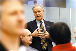 Angus McBeath, the Superintendent of the Edmonton public schools, talks with principals and teachers attending one of the district's mandatory training sessions.